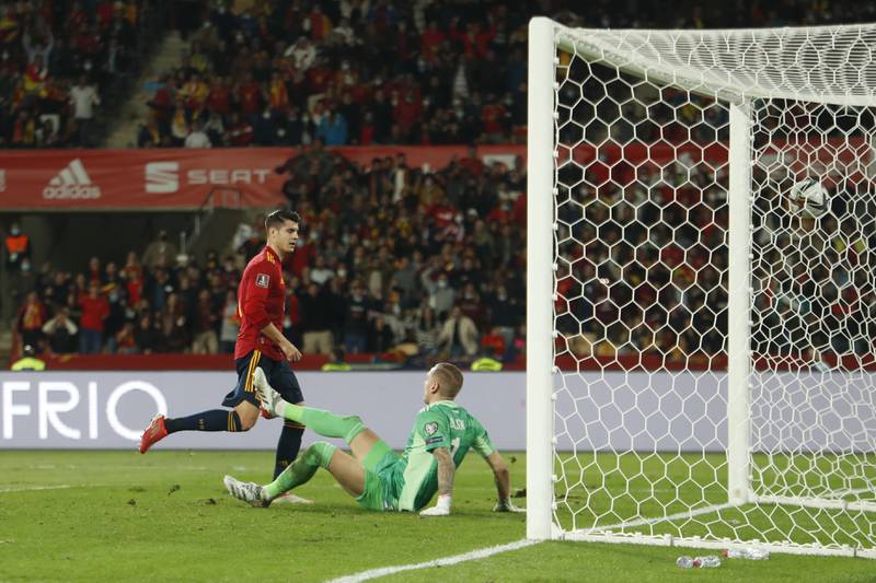 Spain's Alvaro Morata scores the opening goal. AP Photo