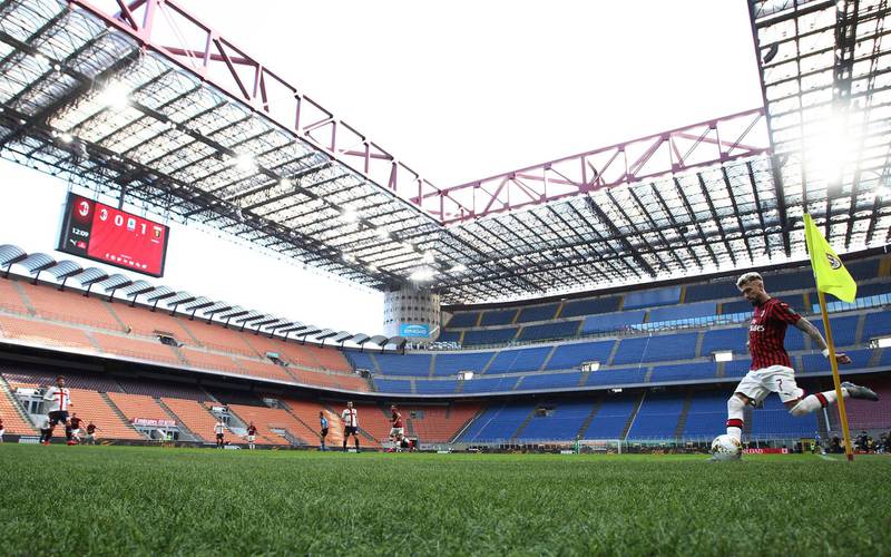 AC Milan's Samu Castillejo takes a corner at an empty San Siro during their 2-1 Serie A home defeat to Genoa on Sunday, March 8. All sports events in Italy have since been cancelled due to the coronavirus outbreak. AP