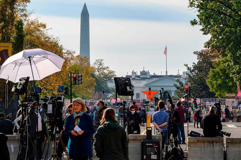 Journalists from all over the world wait for the result of the US Presidential elections on Black Lives Matter Plaza in front of the White House in Washington. AFP