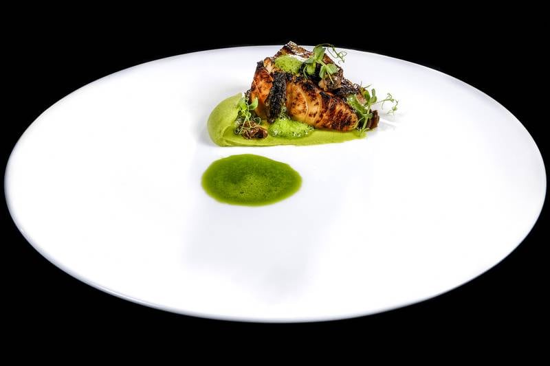 Black fish with peas, snails and morels by chef Valentino Cassanelli. Photo: Lido Vannucchi
