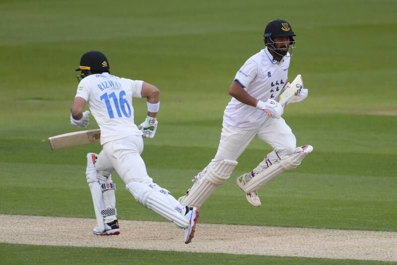 Cheteshwar Pujara and Mohammad Rizwan of Sussex take a quick single during match against Durham in Hove. Getty