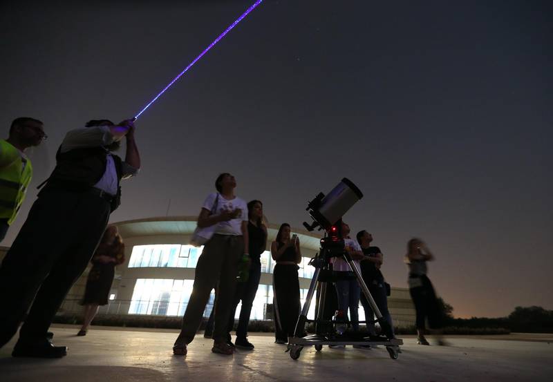 A long exposure picture shows stargazers at Al Thuraya Astronomy Center in Dubai.  EPA/ALI HAIDER
