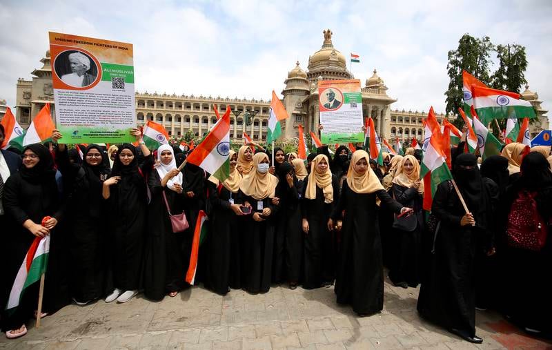 Muslim women carry Indian flags the celebrate Independence Day, in front of Vidhana Soudha, the seat of the state legislature of the south-western state of Karnataka, in Bangalore. EPA