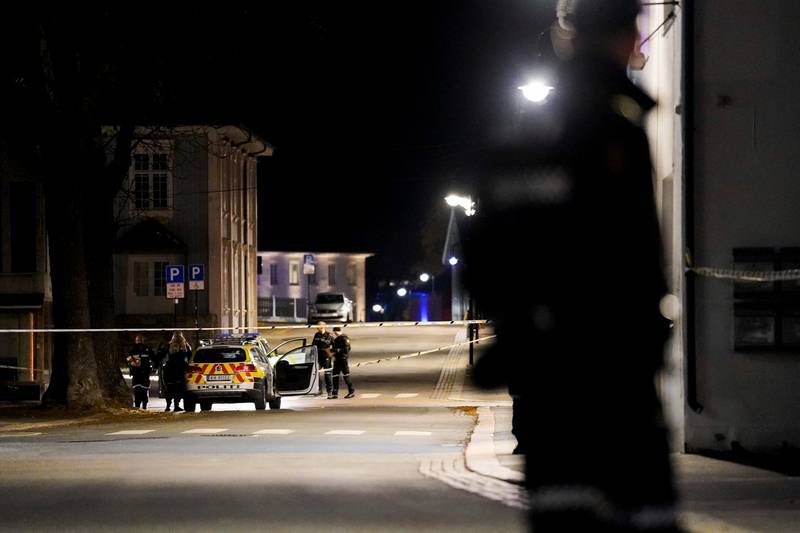 Police officers search the crime scene. Reuters