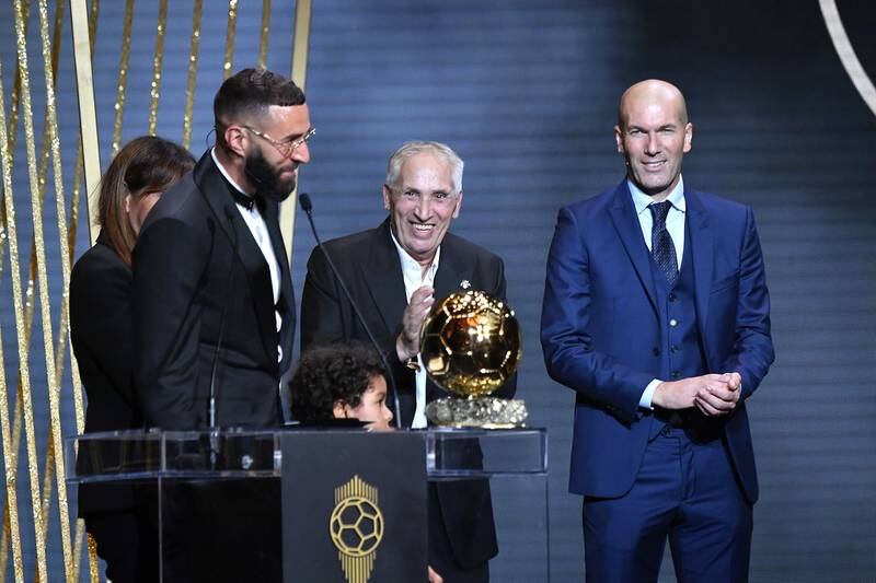 Karim Benzema receives the Ballon d'Or award from Zinedine Zidane next to his mother Malika Benzema, his son Ibrahim and his father Hafid Benzema. Getty Images