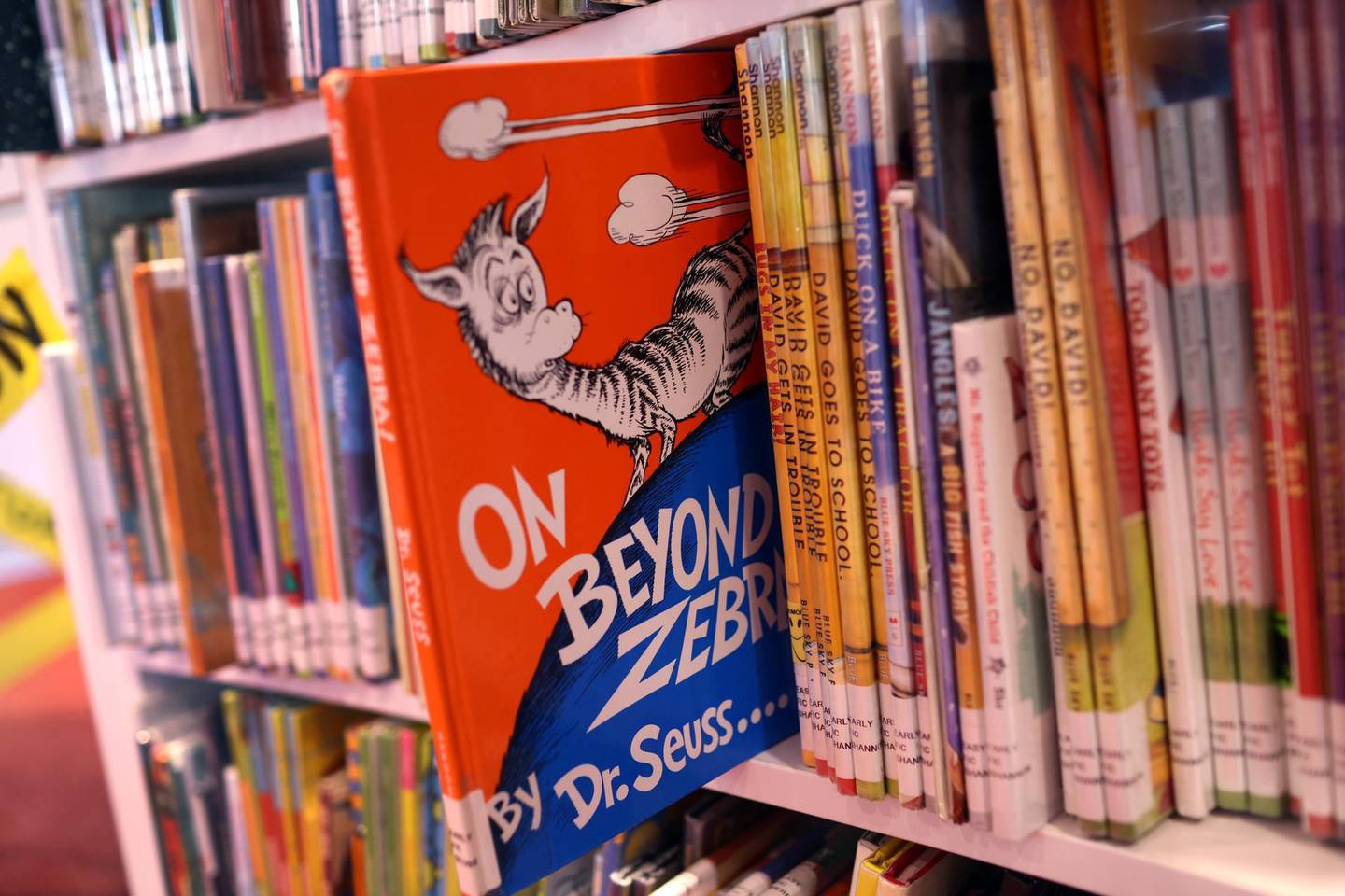 CHICAGO, ILLINOIS - MARCH 02: Books by Theodor Seuss Geisel, aka Dr. Seuss, including "On Beyond Zebra!" and "And to Think That I Saw it on Mulberry Street," are offered for loan at the Chinatown Branch of the Chicago Public Library on March 02, 2021 in Chicago, Illinois. The two titles are among six by the famed children's book author that will no longer be printed due to accusations of racist and insensitive imagery. The other titles include “If I Ran the Zoo,” “McElligot’s Pool,” “Scrambled Eggs Super!" and “The Cat’s Quizzer.” (Photo Illustration by Scott Olson/Getty Images)
== FOR NEWSPAPERS, INTERNET, TELCOS & TELEVISION USE ONLY ==

