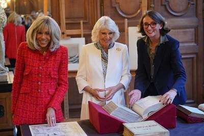 Queen Camilla and Brigitte Macron during a visit to the national library in Paris. PA