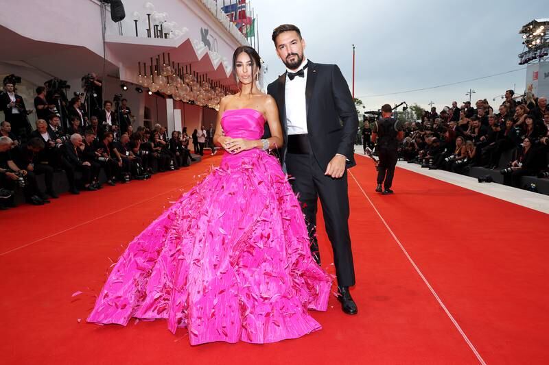 Rosa Perrotta, in a pink Rami Kadi gown, and Pietro Tartaglione, in a classic tuxedo. Getty Images