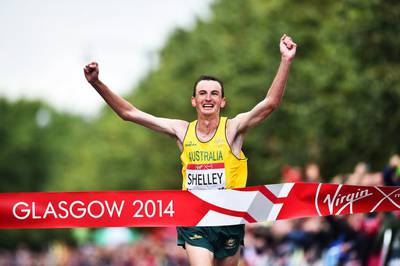 Australia's Michael Shelley celebrates at the finish line as he wins the men's marathon athletics event at the Glasgow City Marathon Course during the 2014 Commonwealth Games in Glasgow, Scotland on July 27, 2014. AFP PHOTO / ANDREJ ISAKOVIC

