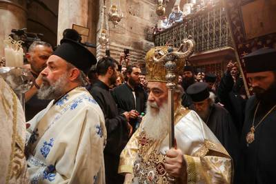Greek Orthodox Patriarch of Jerusalem Theophilos III leads the procession as worshippers gather in the Church of the Holy Sepulchre in Jerusalem’s Old City for the Orthodox Easter ceremonies. AFP