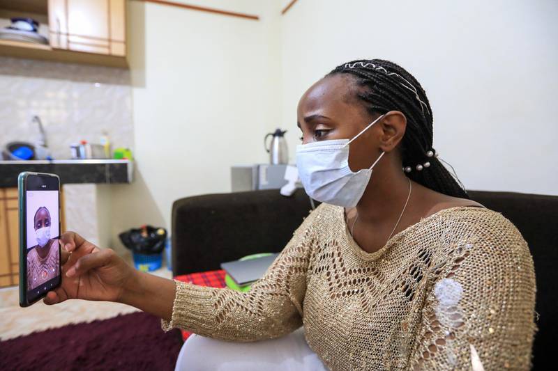 Kenyan woman Naomi Nana, who tested positive for coronavirus for the third time, records a video using her phone, in which she talks about coronavirus and her recovery journey while in isolation in her house in Ruiru, Kiambu, Kenya. EPA