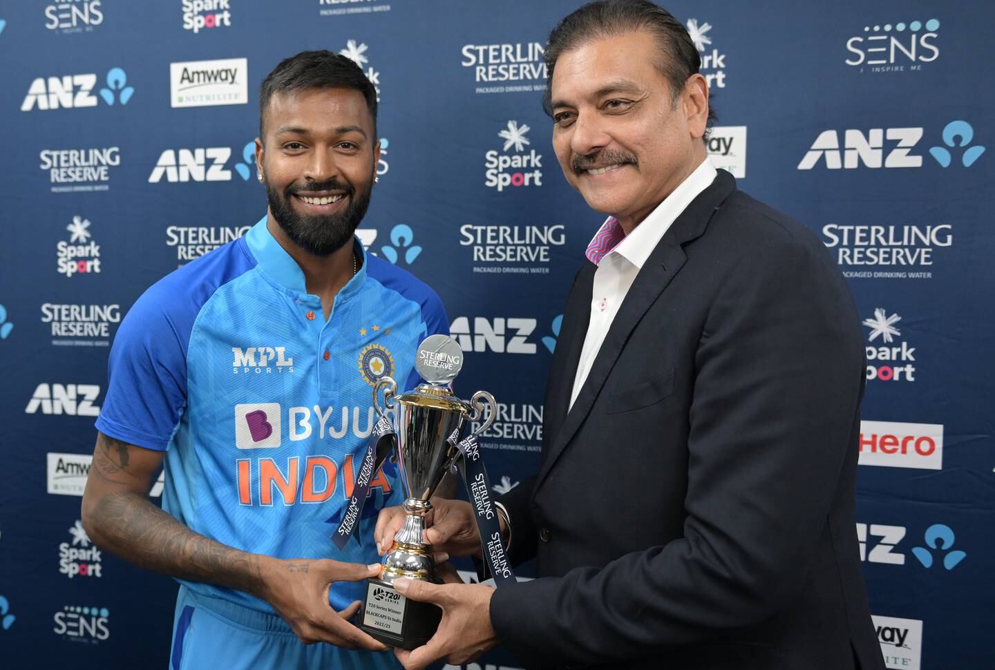 India captain Hardik Pandya receives the T20 series trophy from former coach Ravi Shastri in Napier. Getty