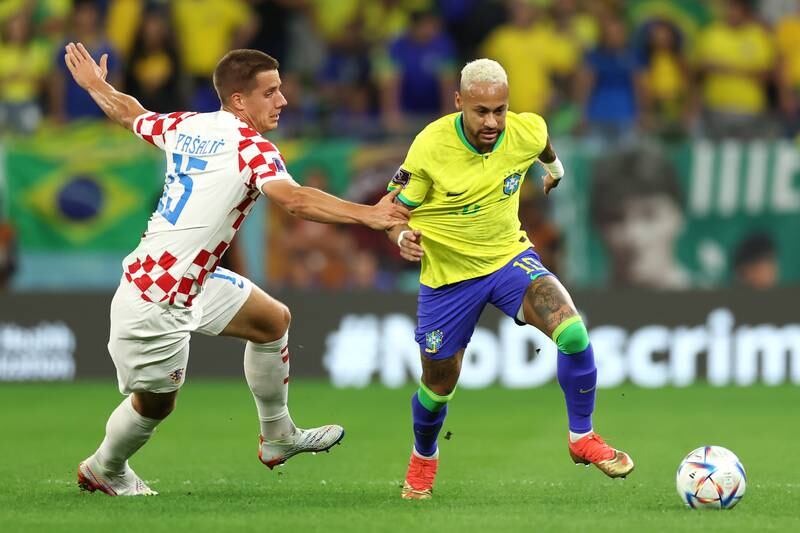 Brazil's Neymar of Brazil attempts to beat Mario Pasalic of Croatia. Getty