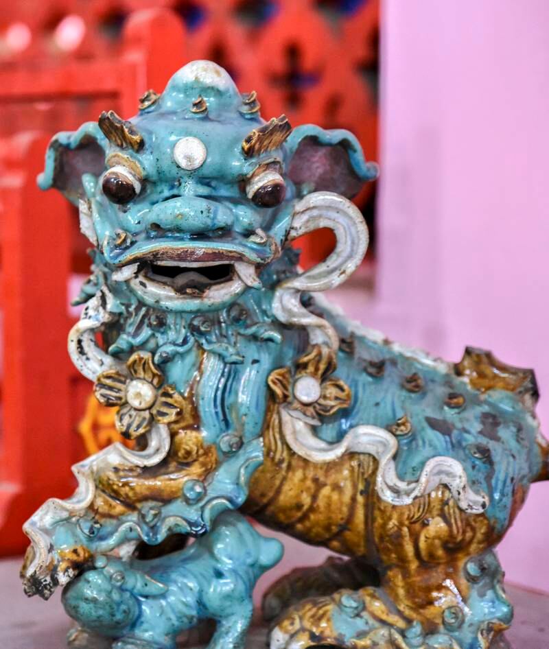 Dragon statues remain scattered throughout Tiretta Bazaar as a symbol of its fading Chinese history.