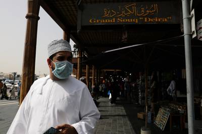 A man wears a protective face mask, following the outbreak of the new coronavirus, as he walks at the Grand Souq in old Dubai, UAE. Reuters