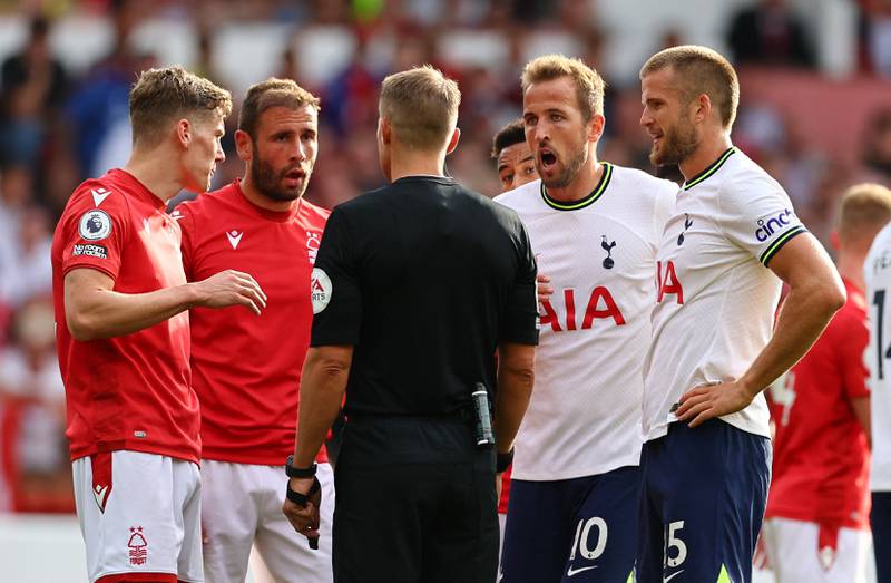 Nottingham Forest's Ryan Yates and Steve Cook and Tottenham Hotspur's Harry Kane and Eric Dier speak with referee Craig Pawson. Reuters