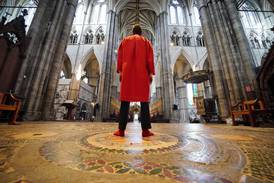 Abbey Marshal Howard Berry stands at the centre of the Cosmati pavement before the altar at Westminster Abbey. PA