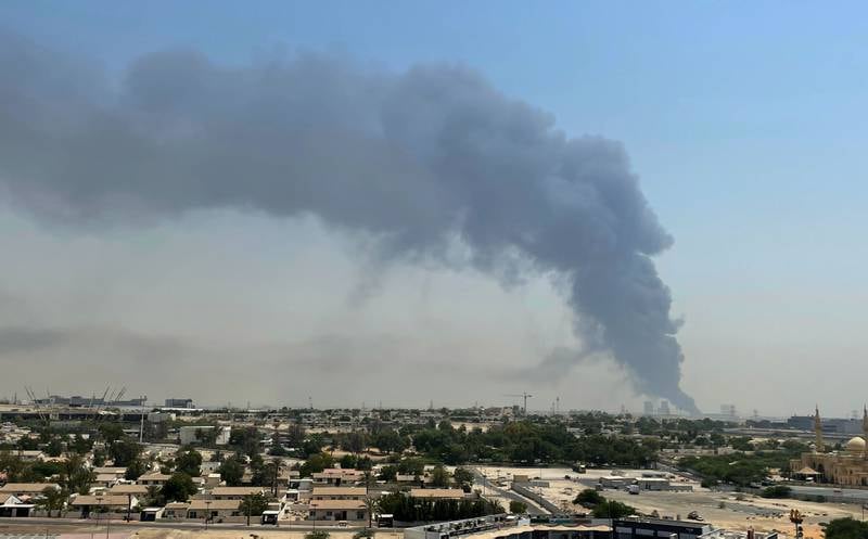 Drivers on Sheikh Zayed Road drove past thick black fumes coming from the plant. James O'Hara / The National