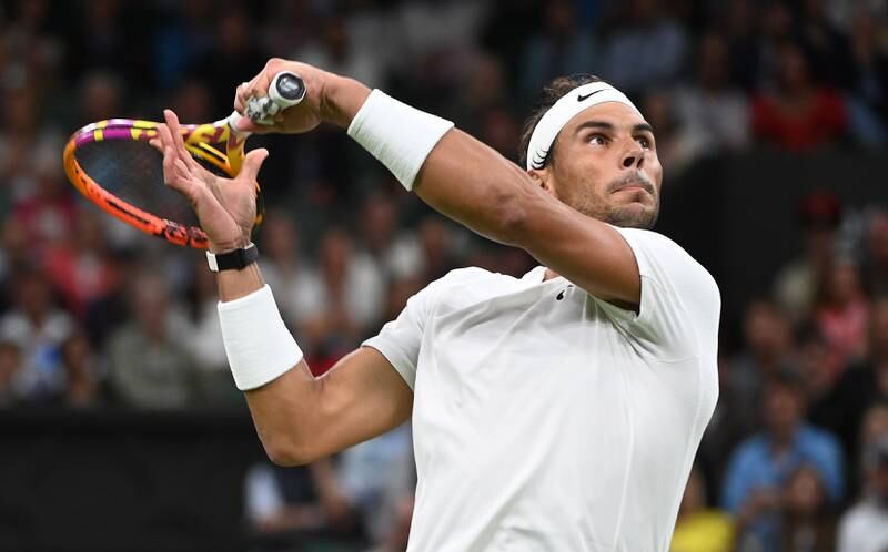 Rafael Nadal plays a shot to Lorenzo Sonego during their third round match at Wimbledon. EPA