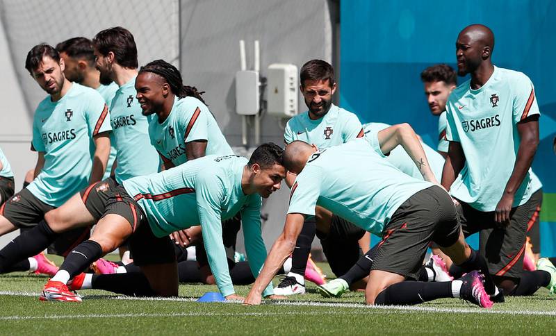 Portugal players stretch during a training session at Illovszky Rudolf Stadium. Reuters