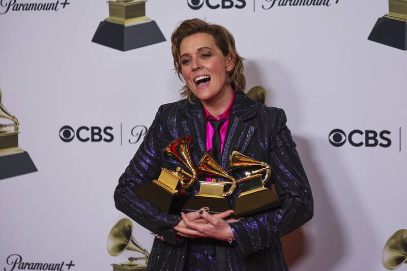 Brandi Carlile with her awards for Best Americana Album, Best Rock Song and Best Rock Performance. Reuters