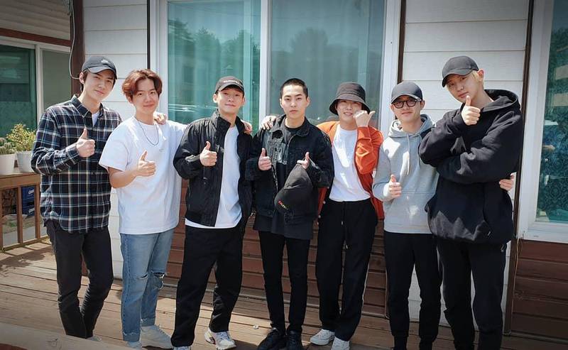 Members of Exo pose together before Xiumin departs for his mandatory military service. 