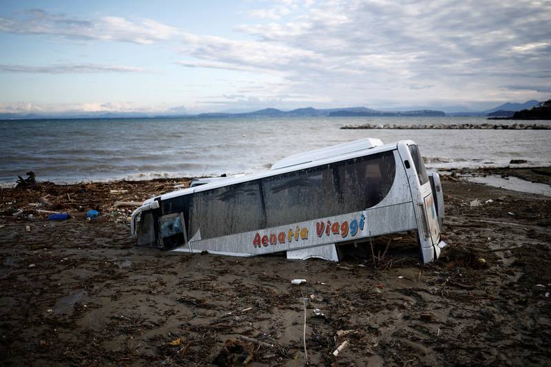 A damaged bus is seen by the sea, following a landslide on the Italian holiday island of Ischia, Italy. Reuters