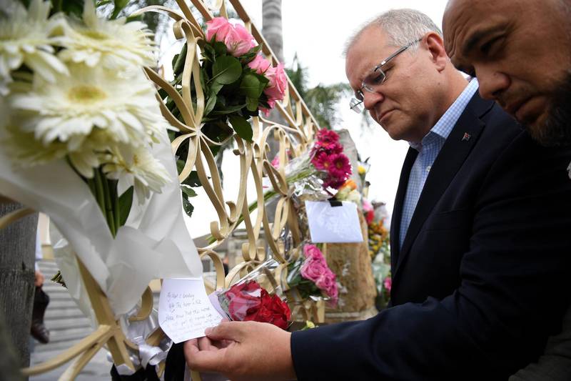epa07441241 Australian Prime Minister Scott Morrison (2-R) looks at floral tributes to the victims of the Christchurch terror attack during a visit to the Lakemba Mosque, at Lakemba in south west Sydney, Australia, 16 March 2019. The Prime Minster met with Islamic community leaders following the terror attack in Christchurch, New Zealand. At least 49 people were killed by a gunman, believed to be Brenton Harrison Tarrant, and 20 more injured and in critical condition during the terrorist attacks against two mosques in New Zealand during Friday prayers on 15 March.  EPA/DAN HIMBRECHTS  AUSTRALIA AND NEW ZEALAND OUT
