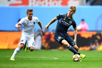 NEW YORK, NEW YORK - SEPTEMBER 14: Keaton Parks #55 of New York City FC controls the ball with pressure from Tommy Thompson #22 of San Jose during their game at Yankee Stadium on September 14, 2019 in the Bronx borough of New York City.   Emilee Chinn/Getty Images/AFP