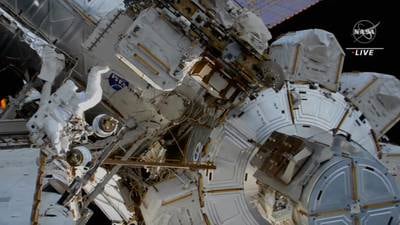 The astronauts carry out maintenance work on the International Space Station