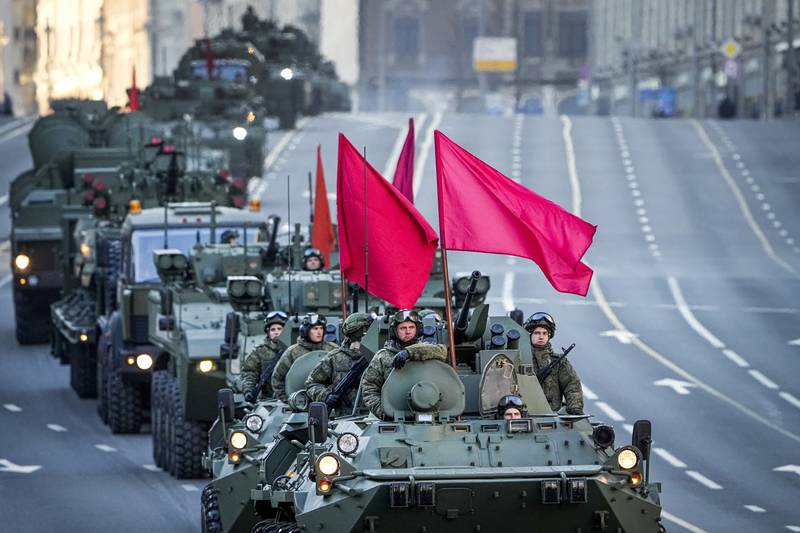 Armoured cars fly the red flag. AP