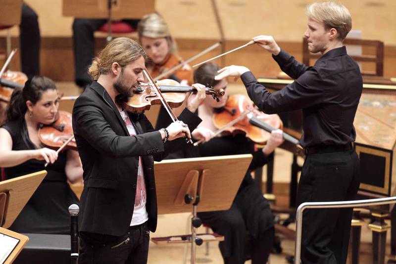 Violinist David Garrett on stage with the conductor Christoph Koncz and the Verbier Festival Orchestra at the Klassik tour at Philhamony Cologne.  Getty Images