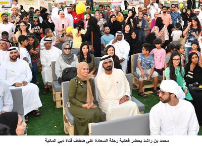 Sheikh Mohammed bin Rashid, Vice President and Ruler of Dubai, sits beside Ohood Al Roumi, Minister of State for Happiness, on Saturday while attending the events of the Inaugural Happiness Journey. Wam