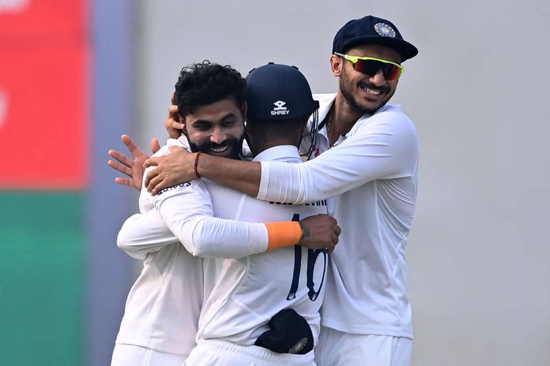 India's Ravindra Jadeja, left, celebrates with teammates after taking the wicket of New Zealand captain Kane Williamson. AFP