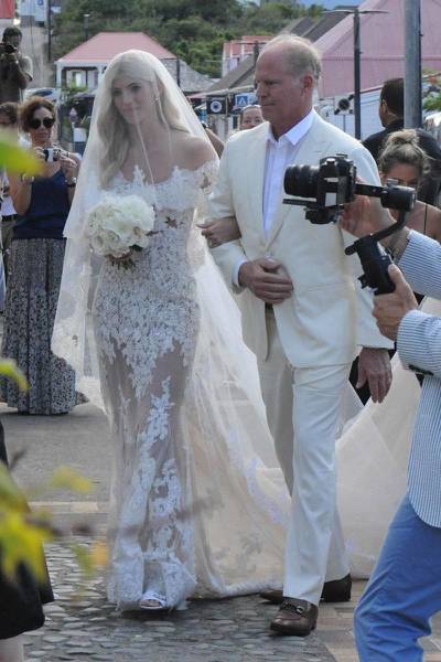 Model Devon Windsor wore a sheer, lacy dress with long veil by Zuhair Murad for her wedding to Alexis co-founder Johnny Barbara in November 2019. Courtesy Devon Windsor