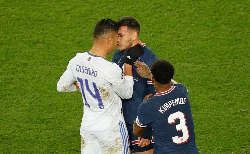 Real Madrid's Casemiro and PSG's Leandro Paredes square up. AFP