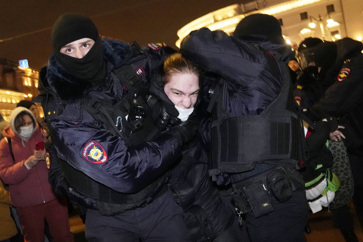 Russian police officers detain a demonstrator in St Petersburg on Thursday. Hundreds of people gathered in Moscow and St Petersburg to protest against Russia's military offensive in Ukraine. AP