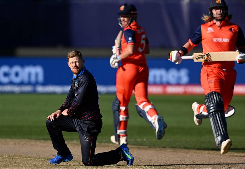 Namibia's Bernard Scholtz looks on as Netherlands' Max O'Dowd and Bas de Leede run between the wickets. AFP