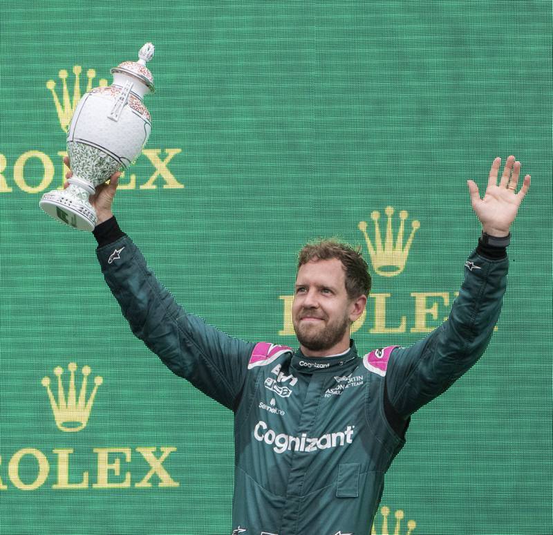 Aston Martin's Sebastian Vettel celebrates on the podium after sealing second place at the Hungarian GP in 2021. EPA 
