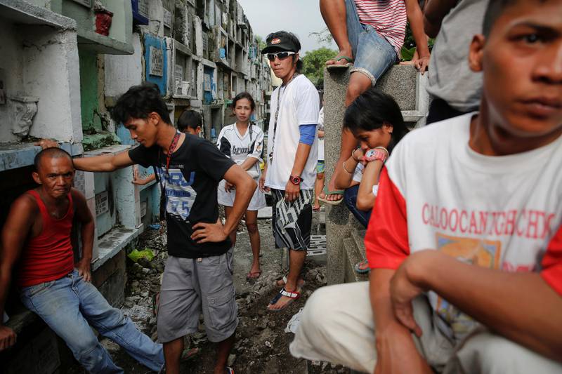 The funeral in Manila of two cousins killed by masked gunmen. Reuters