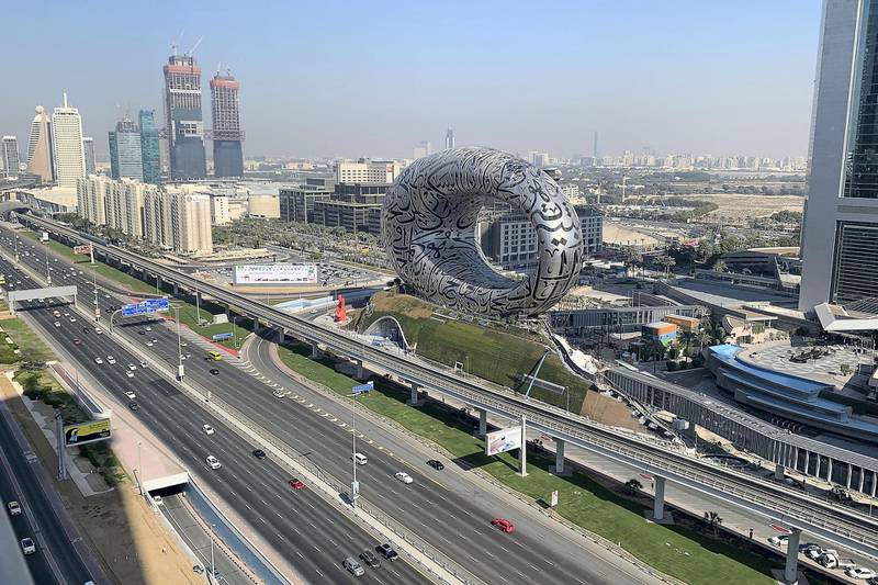 DUBAI, UNITED ARAB EMIRATES , Feb 3 – Workers working on The Museum of the Future on Sheikh Zayed road in Dubai. (Pawan Singh / The National) For News/Online/Standalone/Instagram/Big Picture
