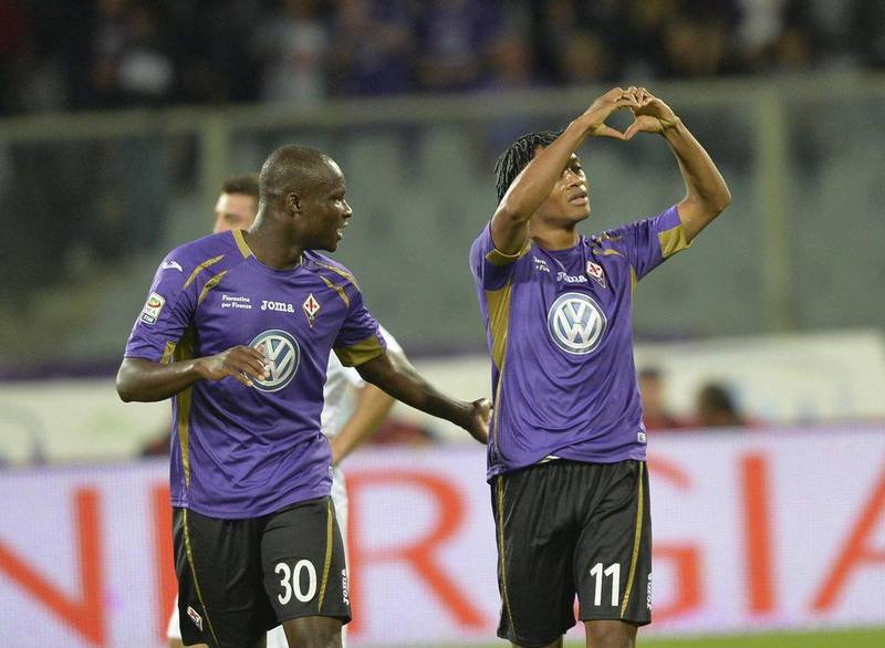 Fiorentina's Juan Cuadrado, right, celebrates after scoring the second of his side's three goals in a win over Inter Milan in Serie A on Sunday in Florence. Maurizio Degl'Innocenti / EPA / October 5, 2014