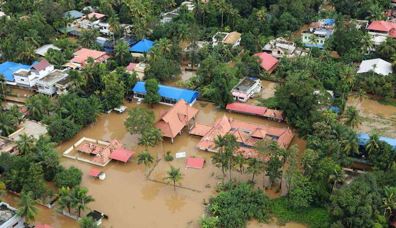 This picture taken on August 18, 2018 shows a view of a flooded area in the north part of Kochi, in the Indian state of Kerala. - Rescuers waded into submerged villages in southern India on August 19 in a desperate search for survivors cut off for days by floods that have already killed more than 350 people. (Photo by STR / AFP)