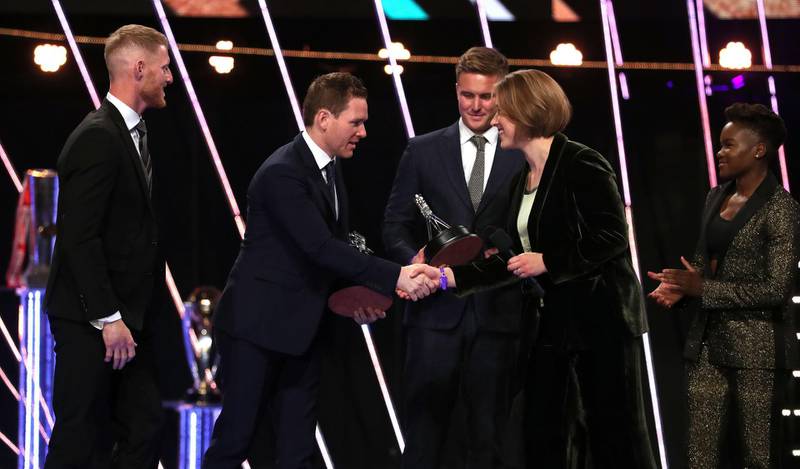 Nicola Adams, right, and Lizzy Yarnold present Eoin Morgan, second left, the Moment of the Year award. PA
