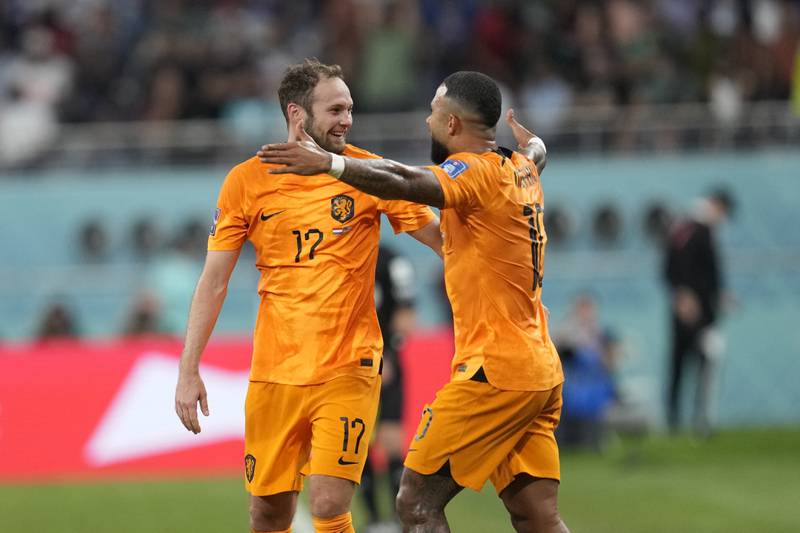 Daley Blind celebrates after scoring with Memphis Depay. AP