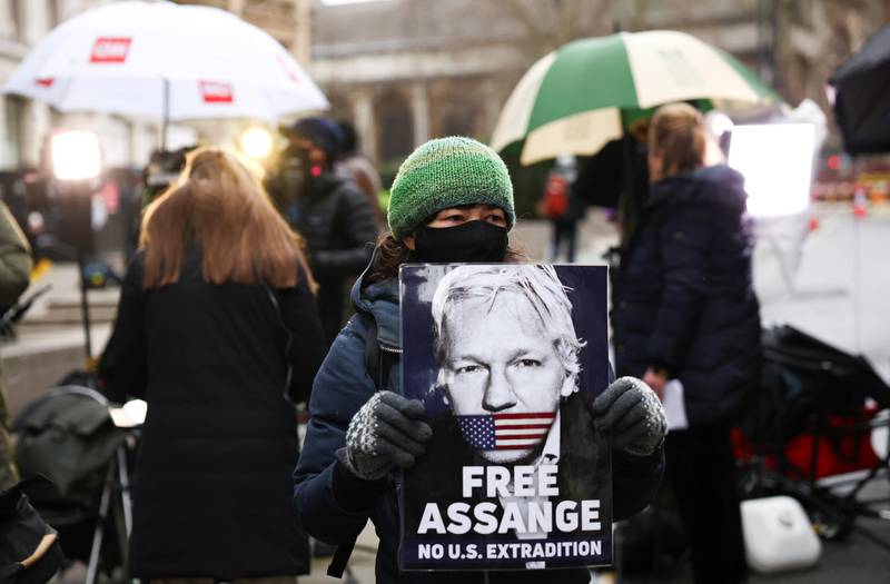 A supporter of WikiLeaks founder Julian Assange holds a placard at the Old Bailey. Reuters