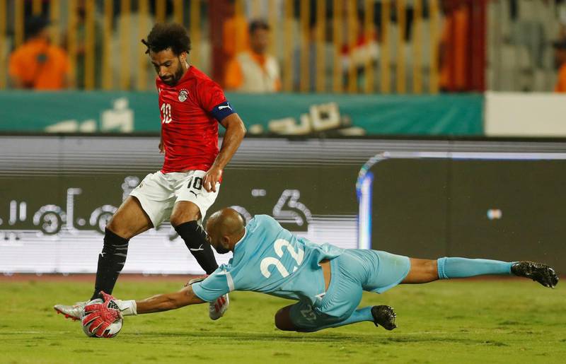 Salah in action with Guinea's Aly Keita. Reuters