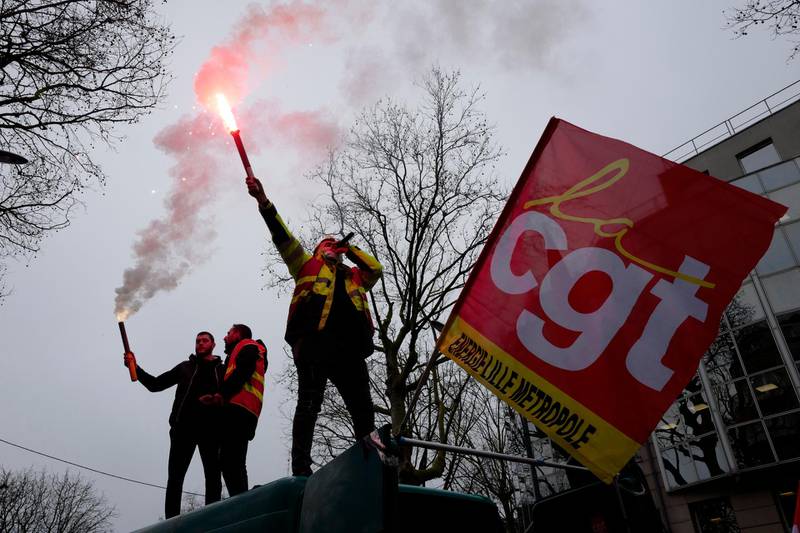 Protesters chant slogans, on top of a van during a demonstration in Lille, northern France. French unions called for strikes and protests around the country to demand more government aid for those struggling financially because of the pandemic. AP Photo