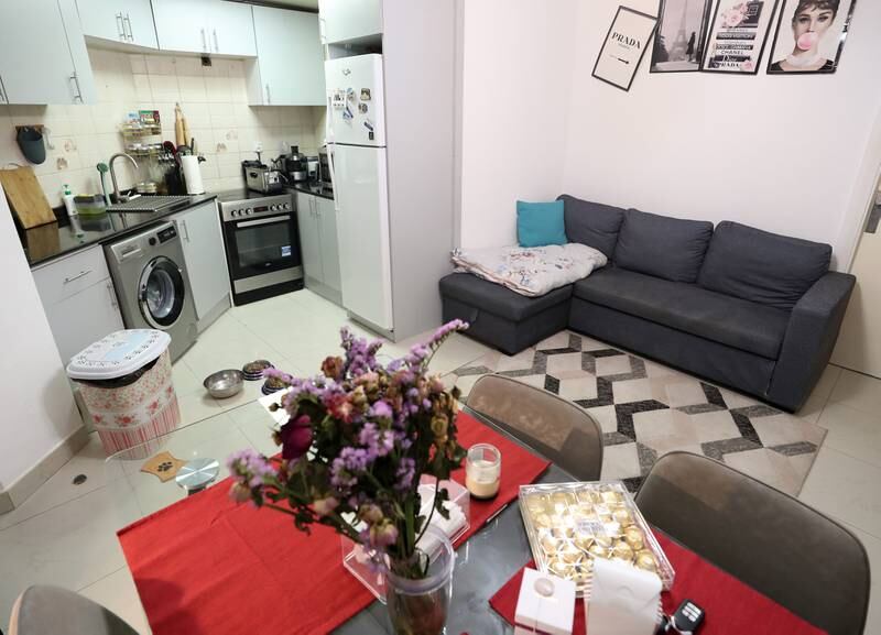 The living area and kitchen of Ms Goma's apartment in Jumeirah Lakes Towers, Dubai.