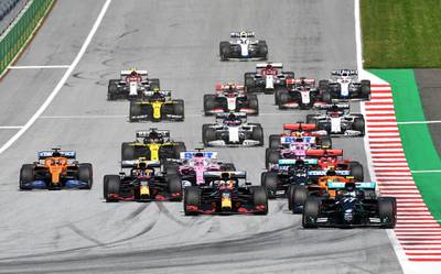 Mercedes' Valtteri Bottas leads Red Bull's Max Verstappen during the first lap of the race.